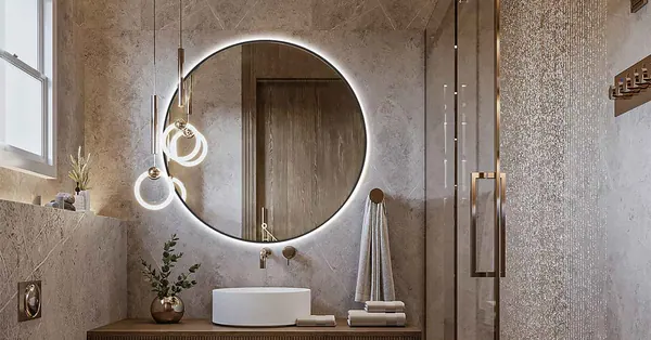 Miroir rond rétroéclairé au-dessus d'un lavabo dans une salle de bains en pierre